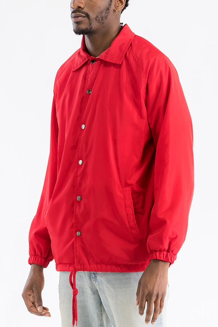 Red coach jacket with button front, stand collar, side pocket, elastic cuffs
