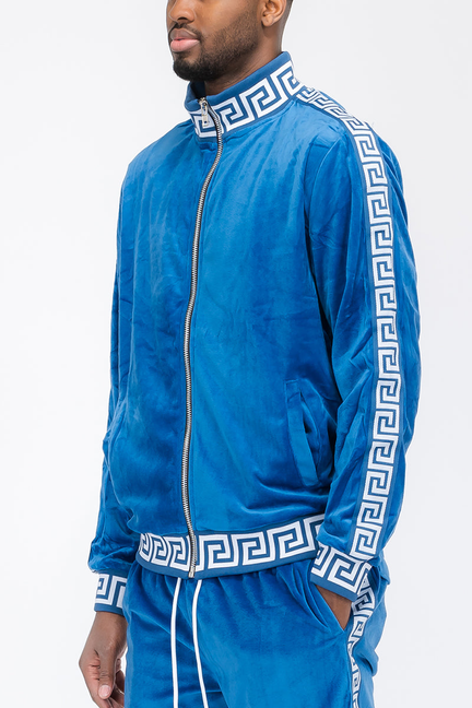 Blue velour track jacket with full-zip front, stand collar, and Greek key trim