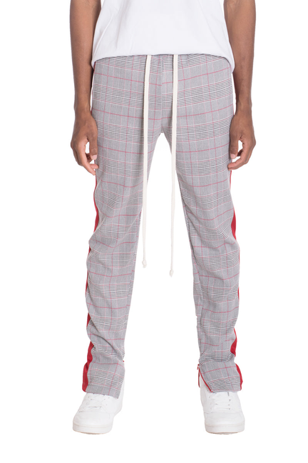 Red and gray plaid track pants with white drawstring and tapered legs