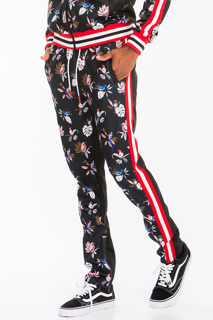 Black floral print track pants with red side stripe and ribbed striped cuff