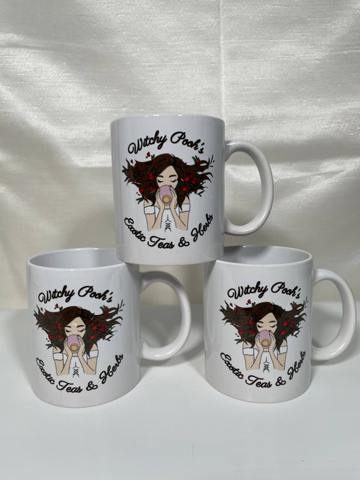Set of three white ceramic mugs with witch girl illustration and "Exotic Teas & Herbs"