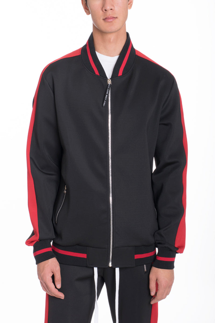 Black track jacket with red piping, front zipper, and striped hem cuff