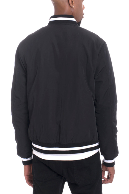 Black twill jacket with white striped hem and cuffs, stand collar, full back view.