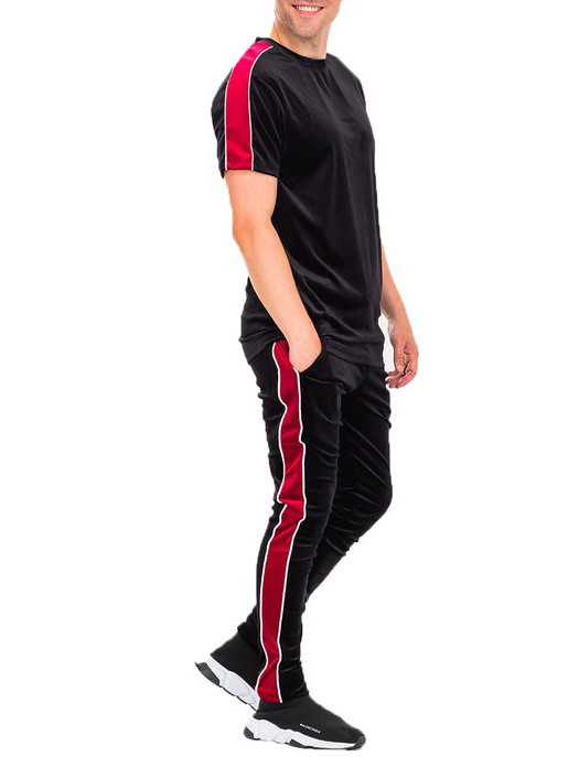 Black velvet tracksuit set with crew-neck short-sleeve top and fitted pants, red piping.