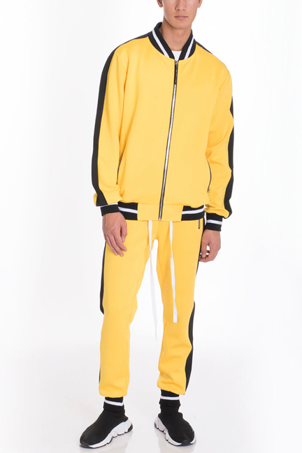 Yellow track suit with zip-up jacket and matching track pants, black striped trim