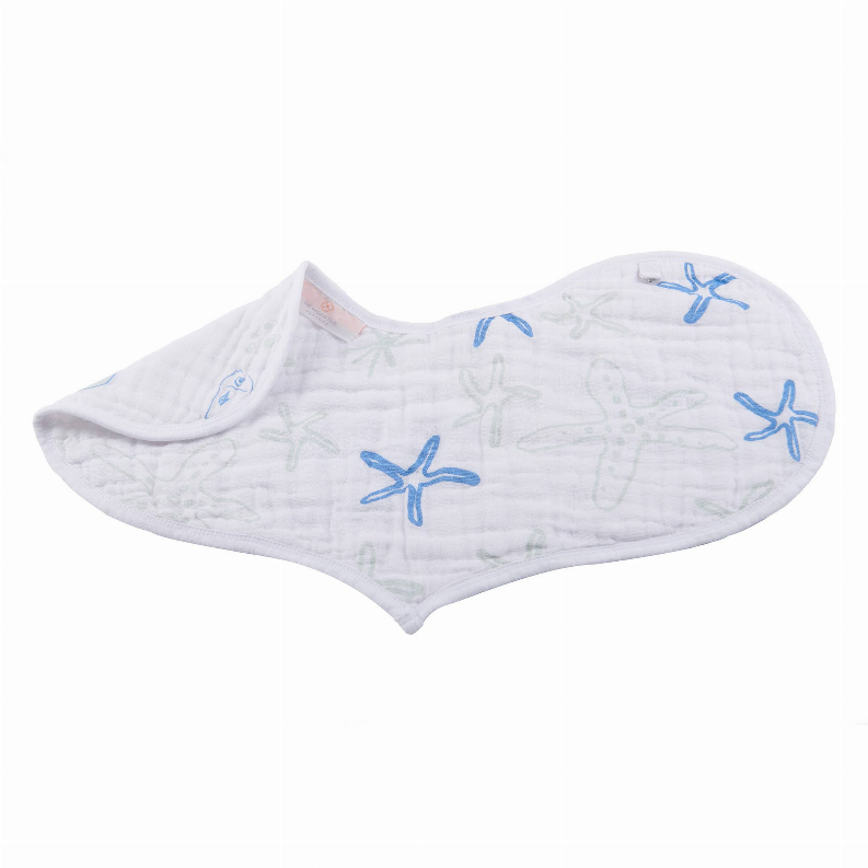 White quilted bib with blue sea creature print and heart-shaped drape