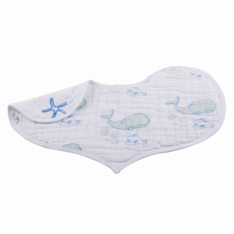 White quilted baby bib with blue whale and fish pattern on the back