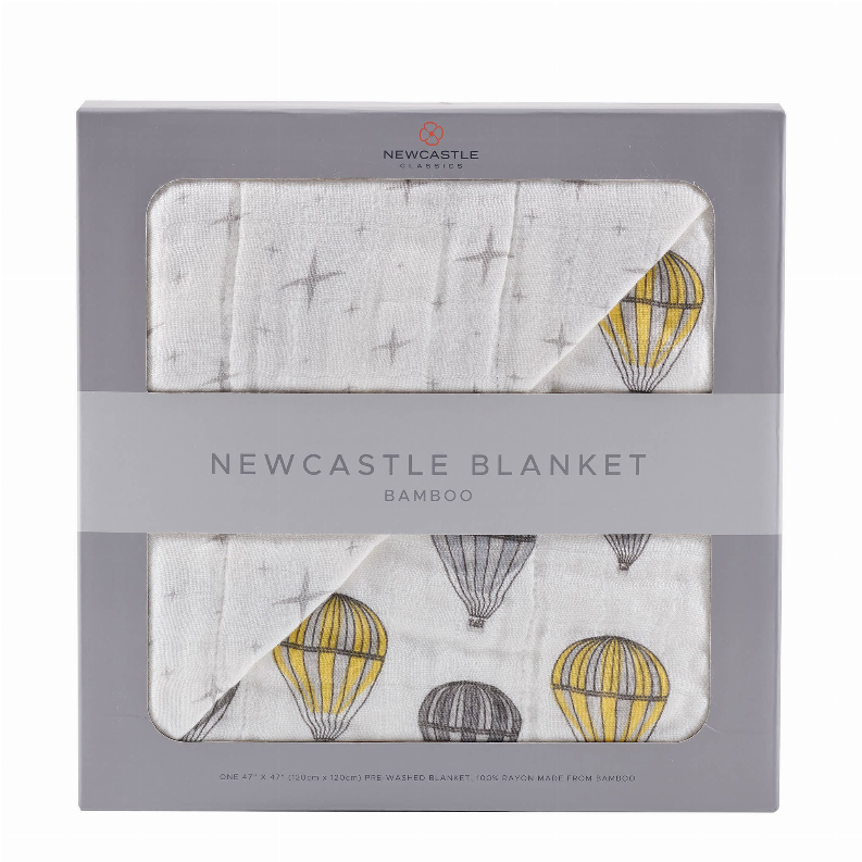 Bamboo baby blanket shown in gift box, gray star pattern with hot air balloons