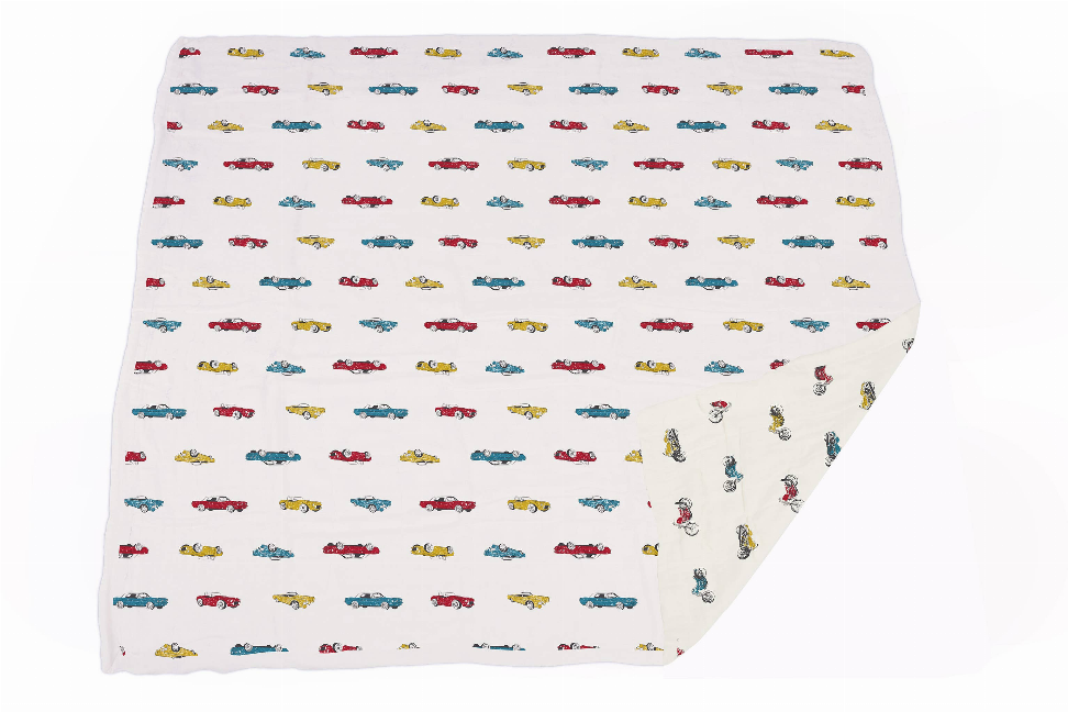 Car-themed blanket with red, blue, and yellow vintage muscle car pattern, folded corner