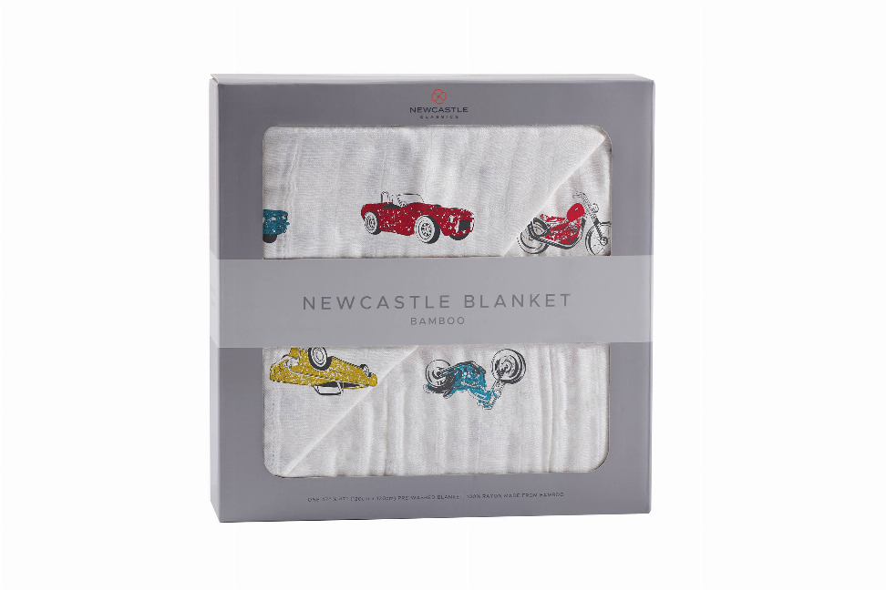 Car print bamboo blanket in gray gift box, folded fabric showing red and blue vehicles