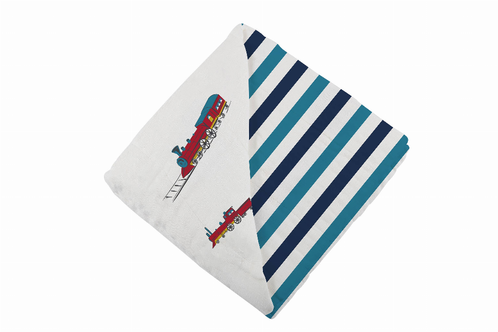 Bamboo blanket corner with steam trains and navy-and-teal striped fabric
