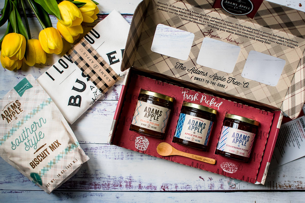 Open Adams Apple Tree-O gift set with three ADAMS APPLE jars in red tray