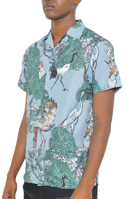 Short-sleeve button-up shirt, bird-and-leaf graphic print on light blue with collar