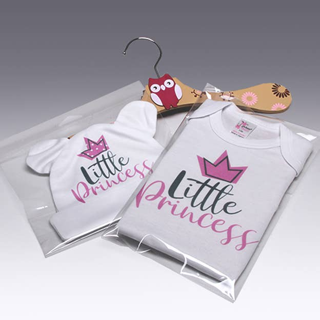 Set of white baby onesies with “Little Princess” crown logo on front