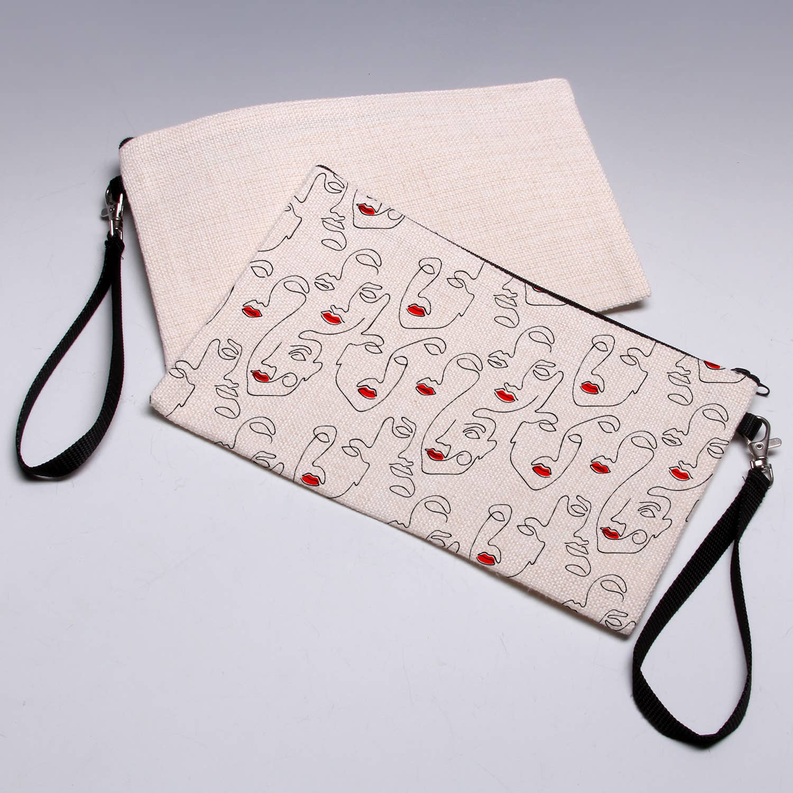 Faces pouch with illustrated face pattern, beige canvas, zip-top and black wrist strap
