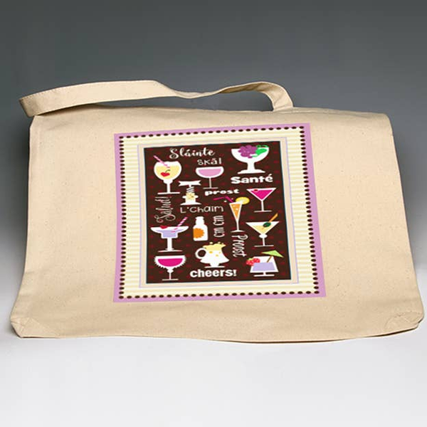 Cream canvas tote bag with printed wine glass graphic and cheers lettering