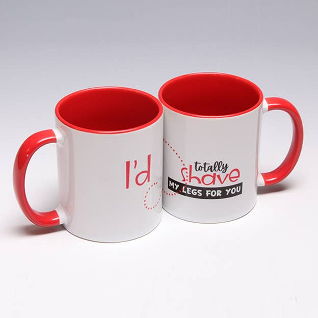 Pair of white mugs with red interiors and handles, printed with “Totally shave” and “My legs for you”