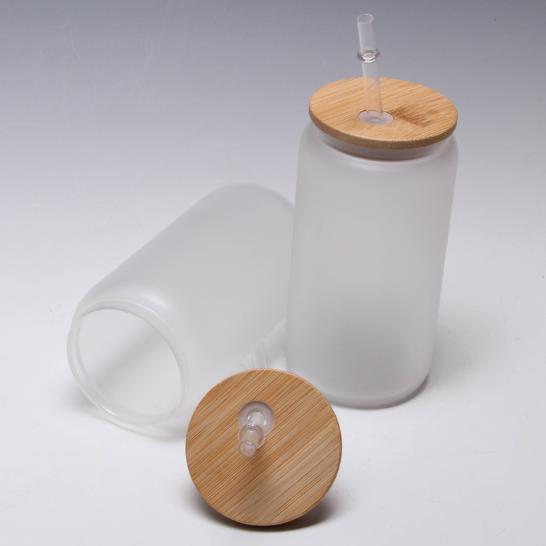 White mason jar tumbler with bamboo lid and clear straw, with wooden insert base
