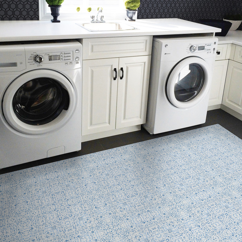 Blue floral non-slip rug, flat lay with tight speckled print