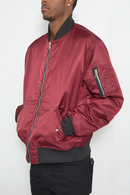 Burgundy padded bomber jacket with full zipper, ribbed cuffs, and side pockets