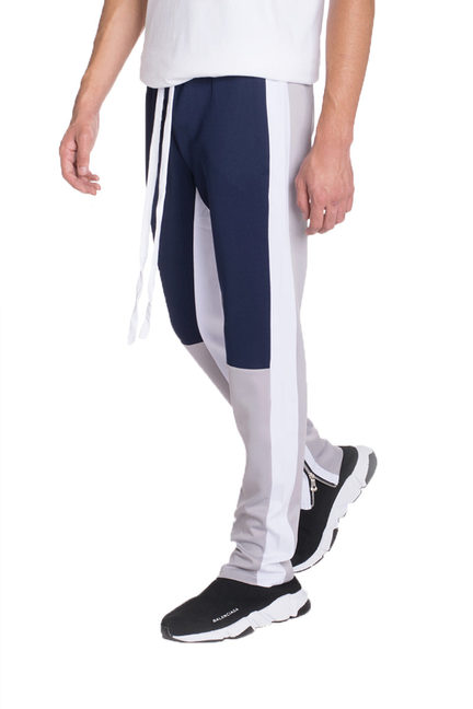 Jordan color block track pants in navy and grey, side stripe panel design