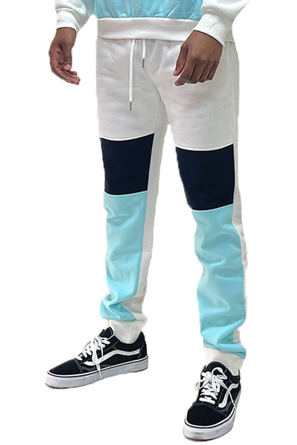Color-block sweatpants with drawstring, white waistband, navy knee, aqua legs.