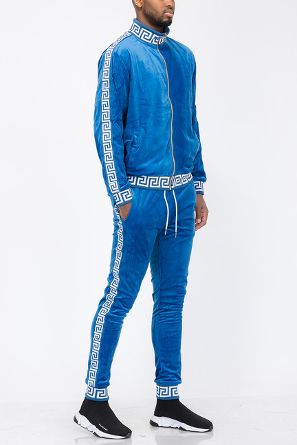Blue velour track set with white Greek-key trim, zip jacket and matching jogger pants
