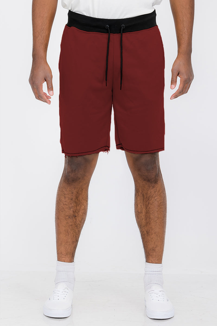 Burgundy sweat shorts with elastic drawstring waist and side pockets