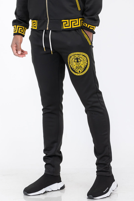 Black jogger pants with lion head patch and yellow trim, drawstring waist