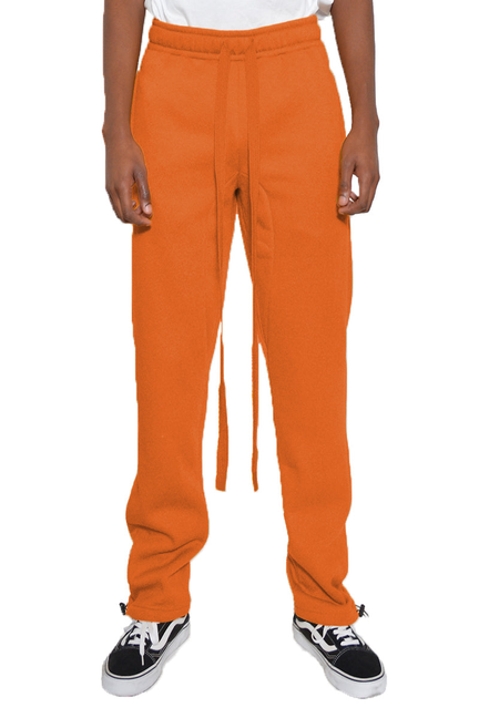 Orange cotton fleece sweatpants with drawstring waist and toggled cuffs