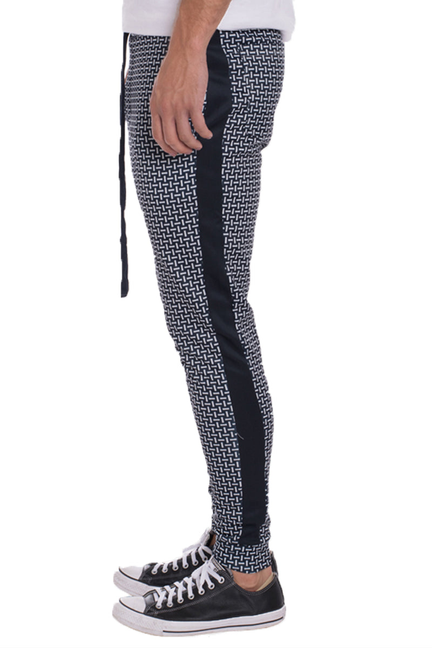 Navy patterned track pants with side stripes and tapered legs