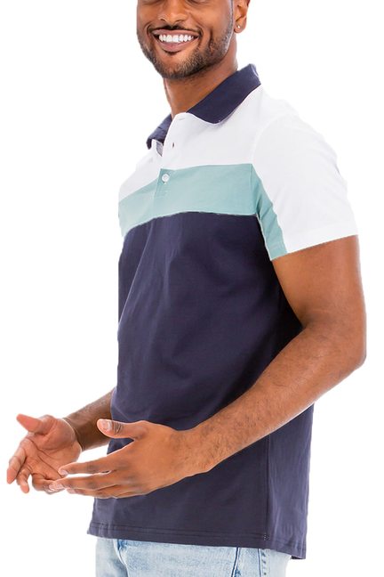 Color-block polo shirt with navy body, teal panel, and white short sleeves, button collar