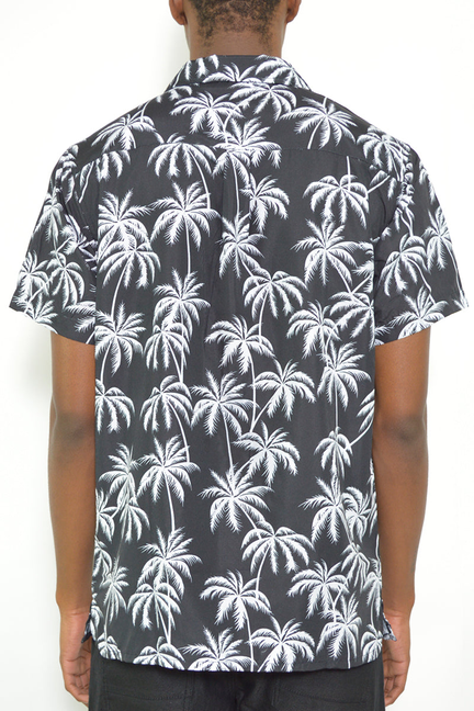Men's short-sleeve shirt with white palm print, back view on dark fabric