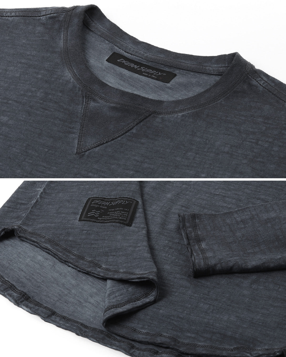Men's dark gray crewneck long-sleeve T-shirt close-up of label and raw-edge hem