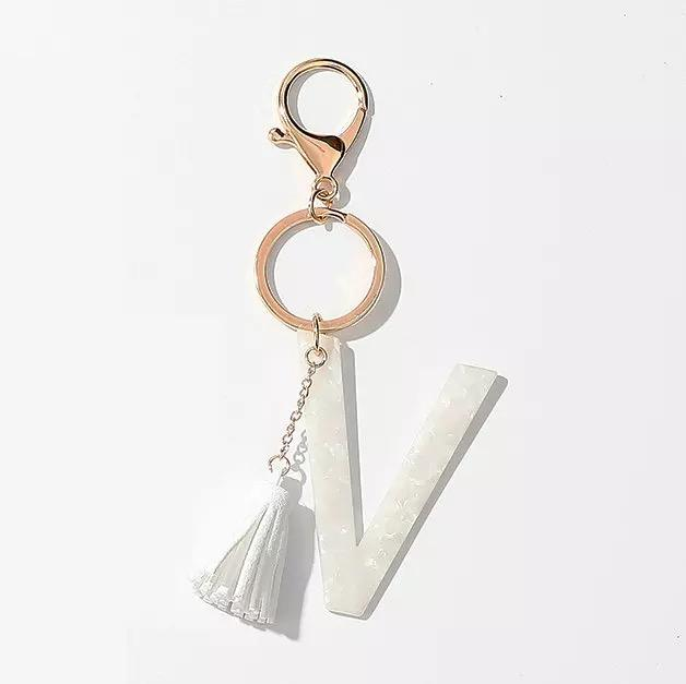 White tassel initial V key chain with split ring and clasp