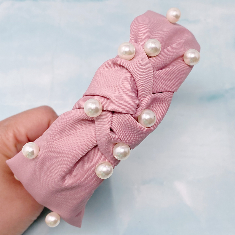 Pink fabric pearl headband with knotted bow and round faux pearl accents