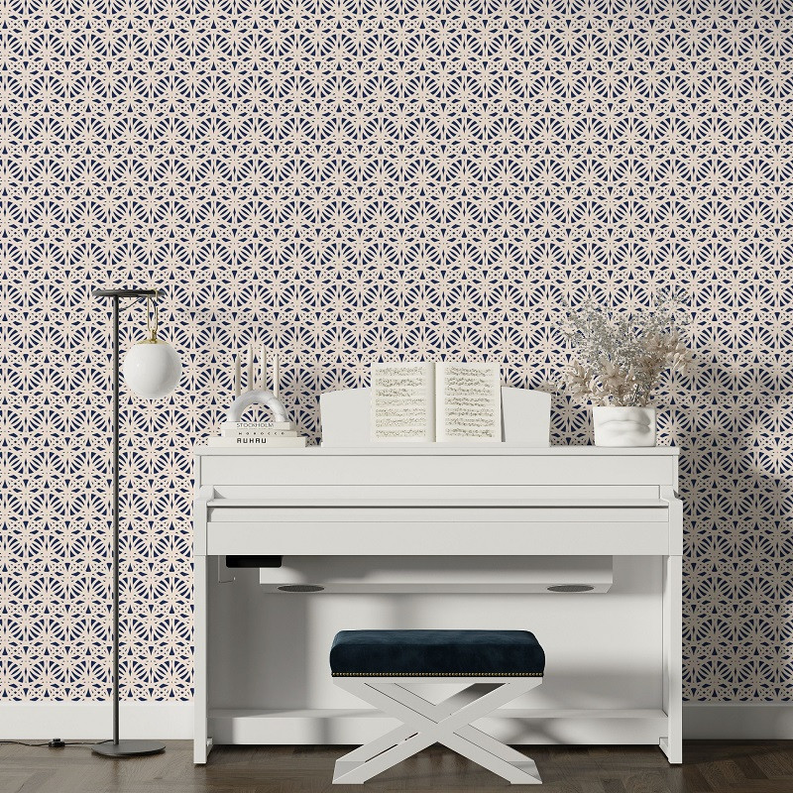 Peel-and-stick wallpaper covering wall with navy-and-cream Moroccan medallion pattern