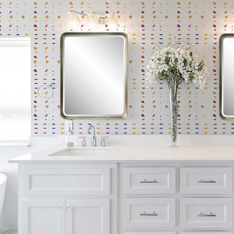Multi-color polka dot peel-and-stick wallpaper on bathroom wall above vanity sink.