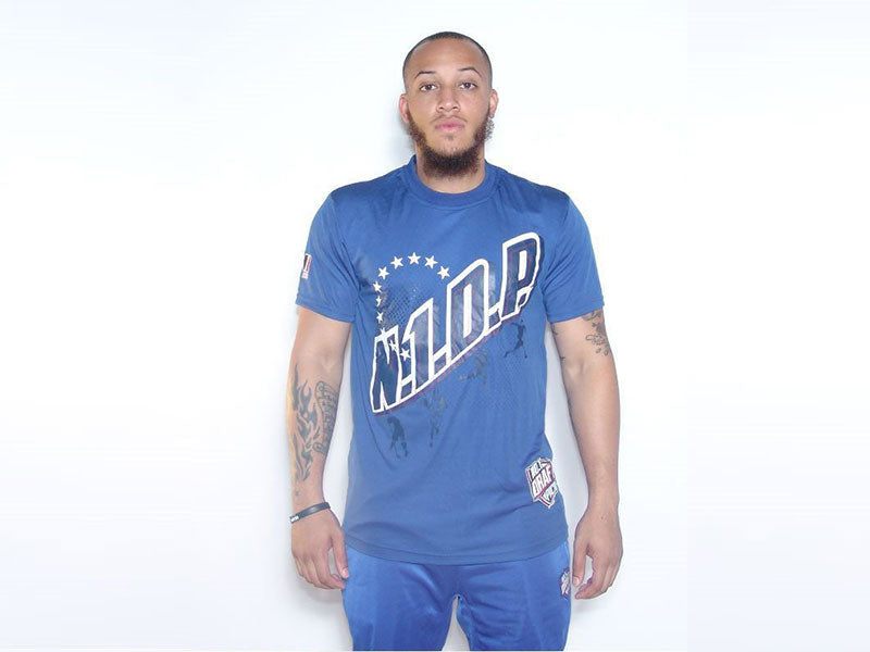 Blue crew-neck sports t-shirt with big front emblem graphic.