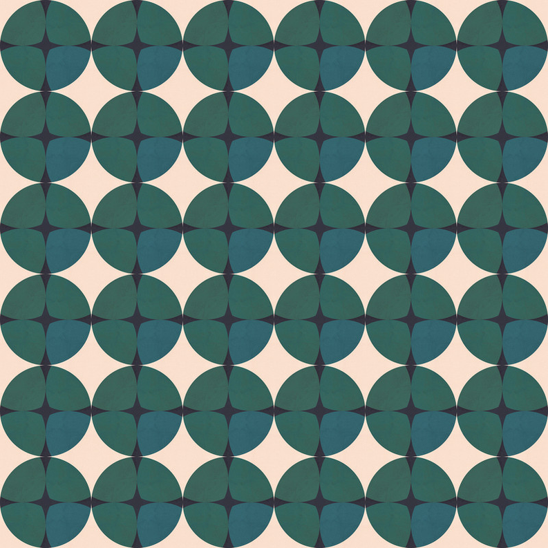 Close-up of teal circle and star geometric peel-and-stick wallpaper pattern