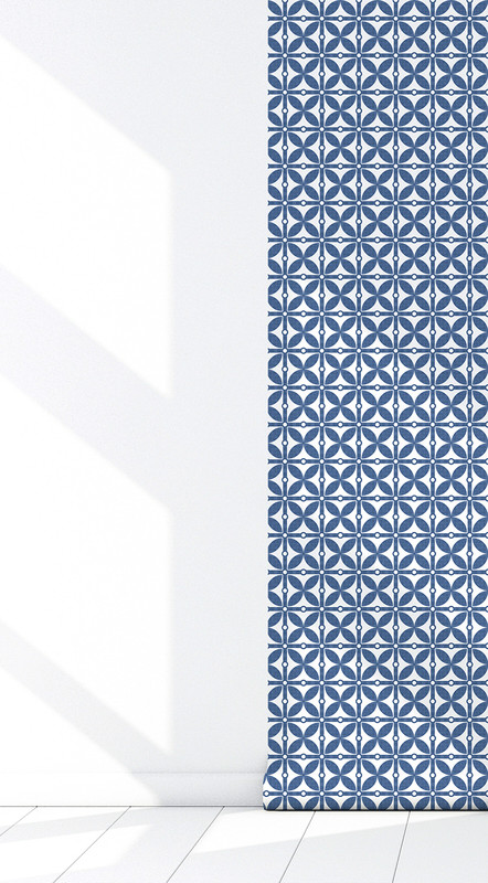 Blue and white geometric peel-and-stick wallpaper on a corner wall with white trim