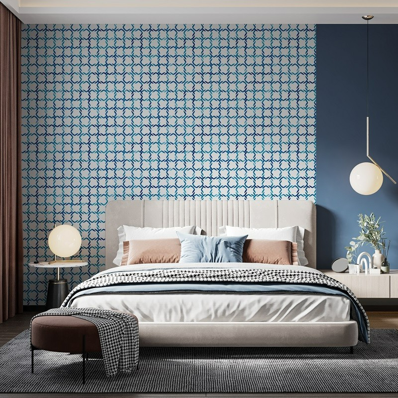 Peel-and-stick wallpaper with blue interlocking geometric lattice pattern on wall
