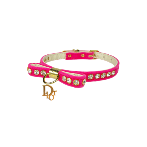 Pink velvet dog collar with rhinestone studs, gold ring clasp, and hanging charm