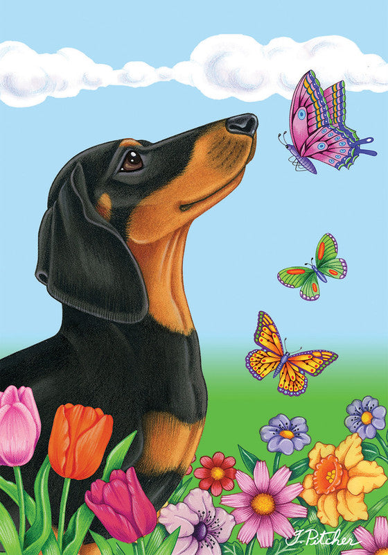 Garden flag featuring a black and tan French bulldog with colorful butterflies and flowers