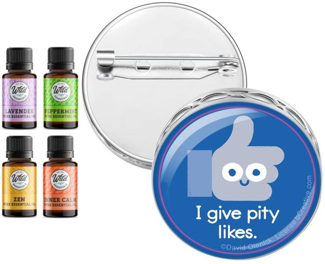 Round pin brooch diffuser with blue “I give pity likes” design and 4 essential oil bottles