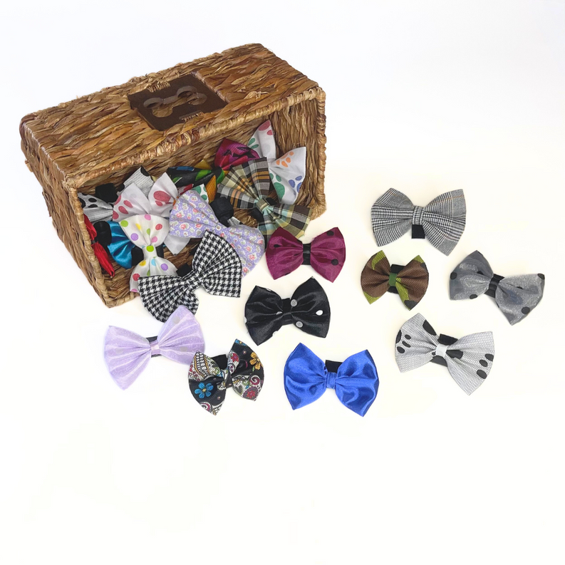 Assorted pet bow hair clips in a woven basket, with stripes, plaid, polka dots, and solids