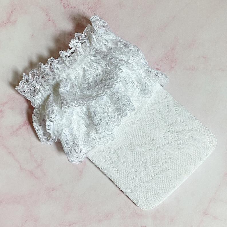 Light gray lace socks with floral texture and ruffled cuff