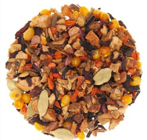 Loose-leaf herbal tea blend with dried pumpkin spice pieces and orange kernels
