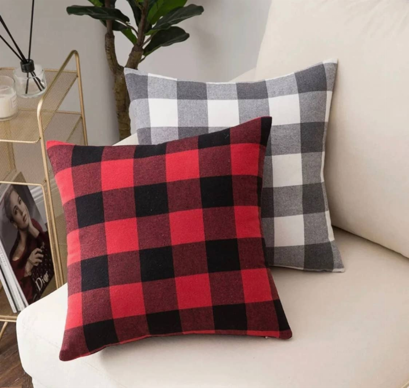 Red and black buffalo plaid throw pillow cover on couch, square stitched edges