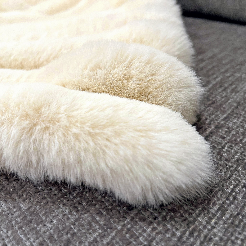 Ivory faux fur throw corner with long shaggy pile, plush texture